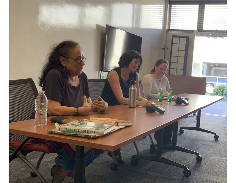 Three Alaska Native women panelists at the guest speakers' table