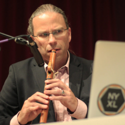 John-Carlos Perea, an associate professor for American Indian Studies, checks the sound while playing his flute for his performance in a recital at Knuth Hall at SF State on Wednesday, Oct. 17, 2018